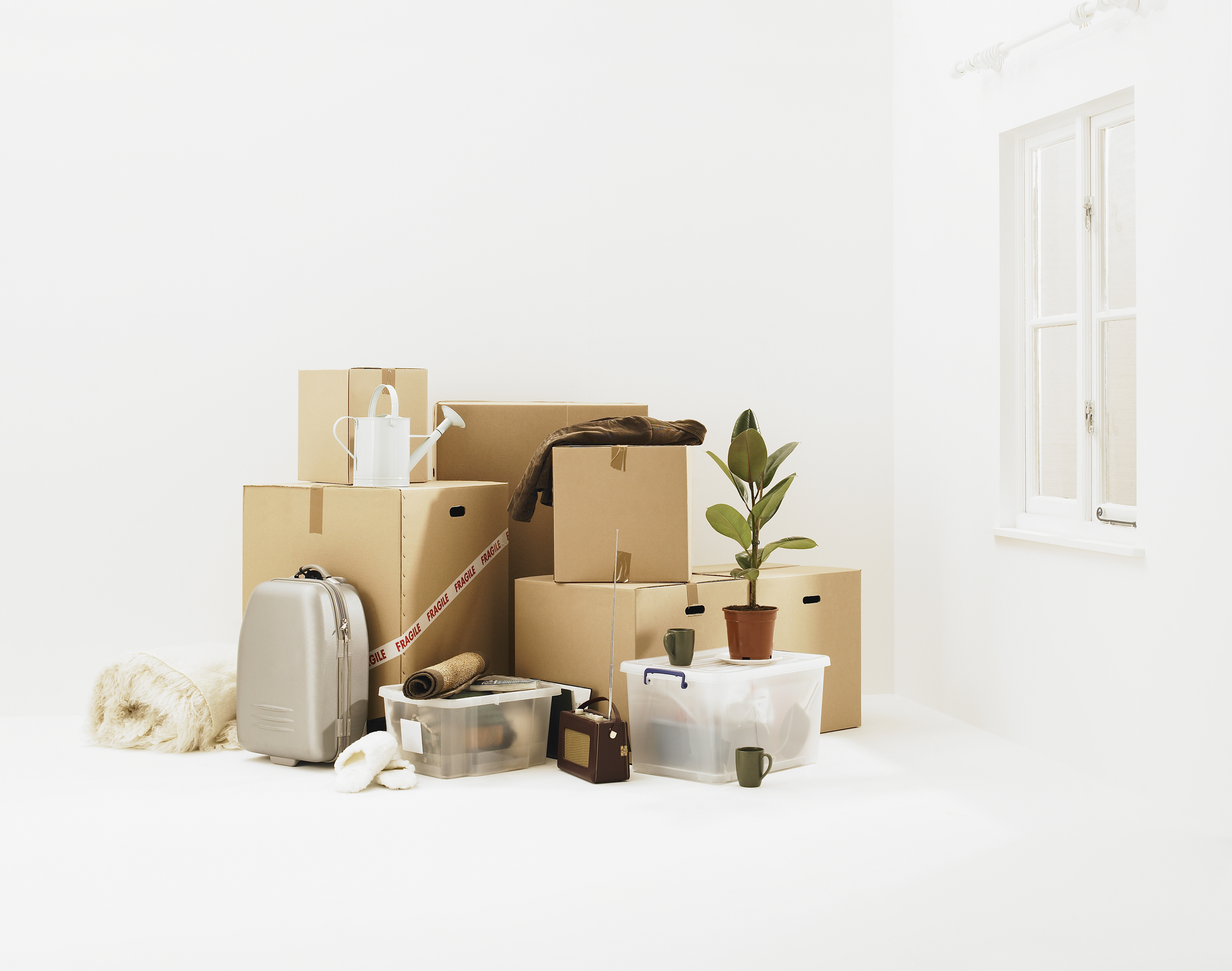 Household belongings in white room.